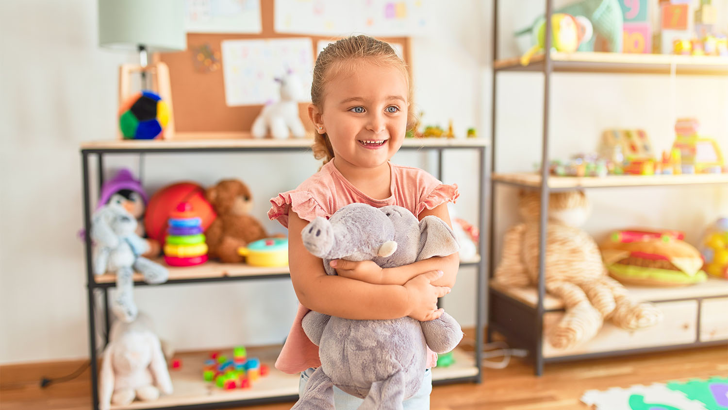 happy little girl in her playroom