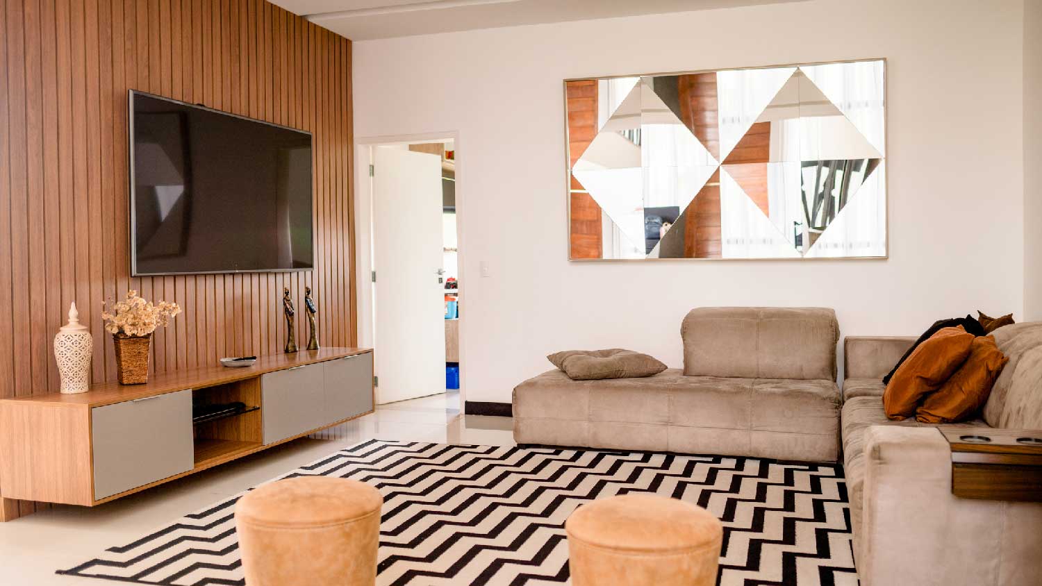 A living room with acoustic panels behind the tv