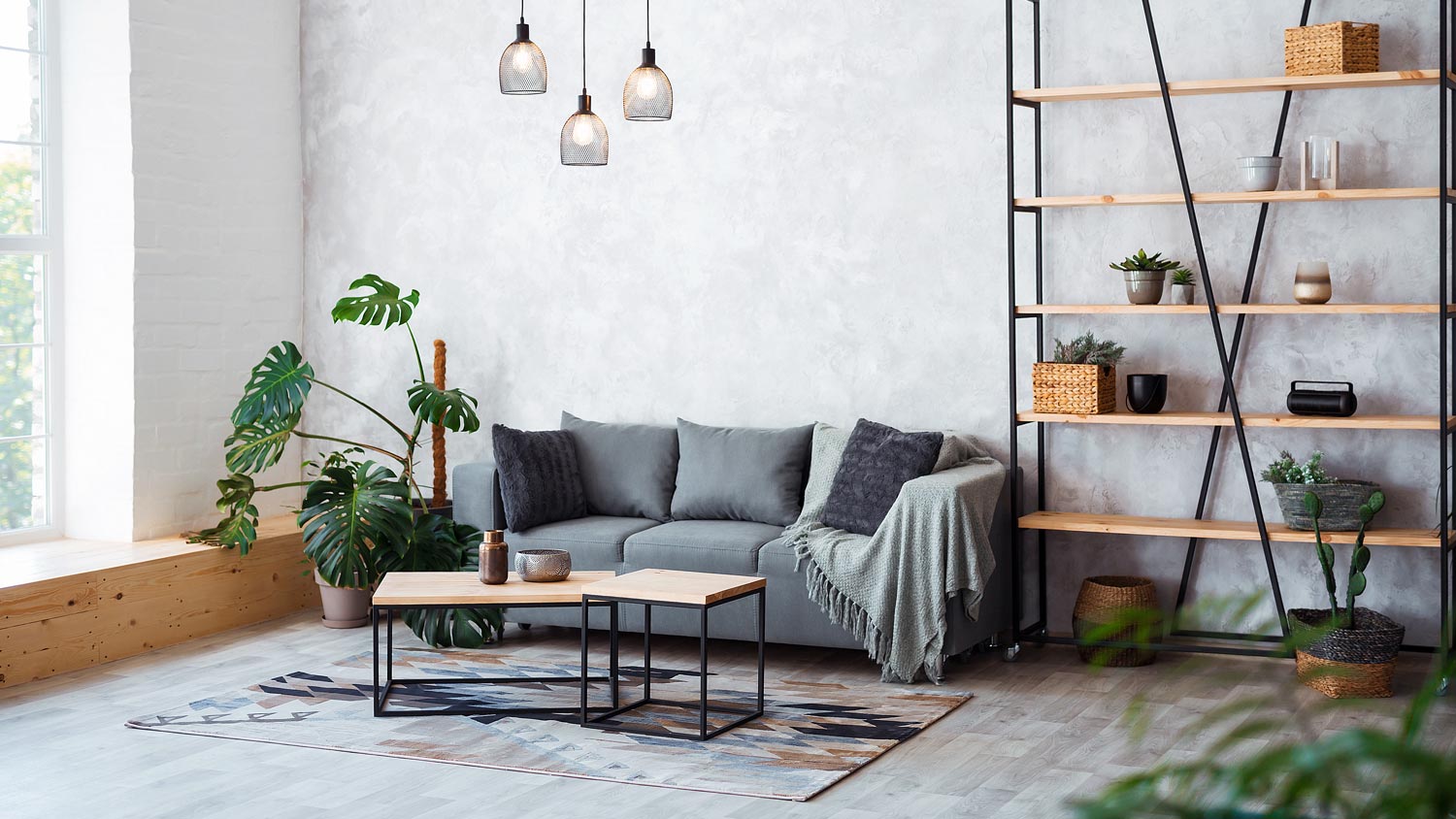 A living room with a bookcase and wooden coffee table