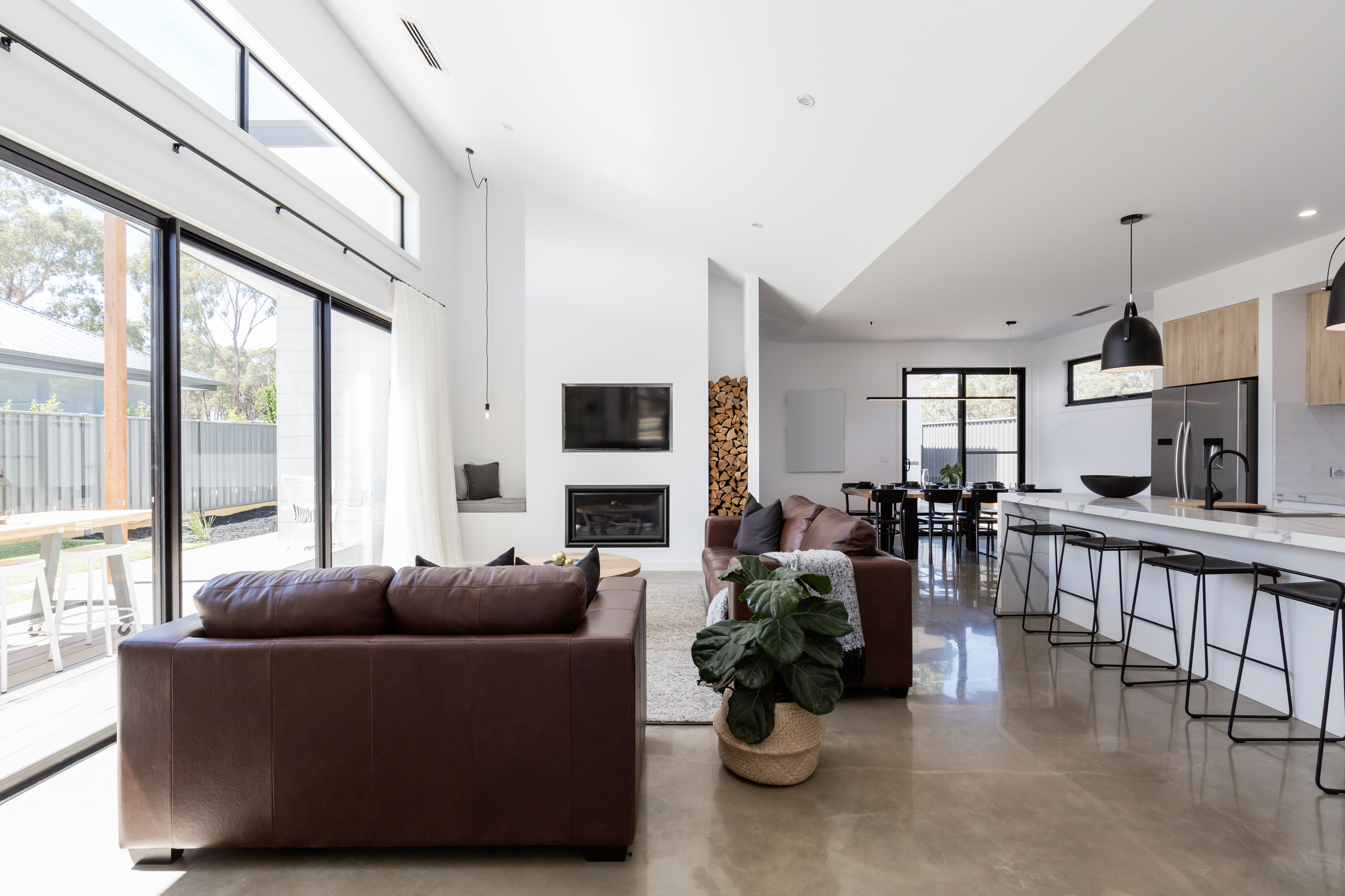 living room dining area with concrete floor
