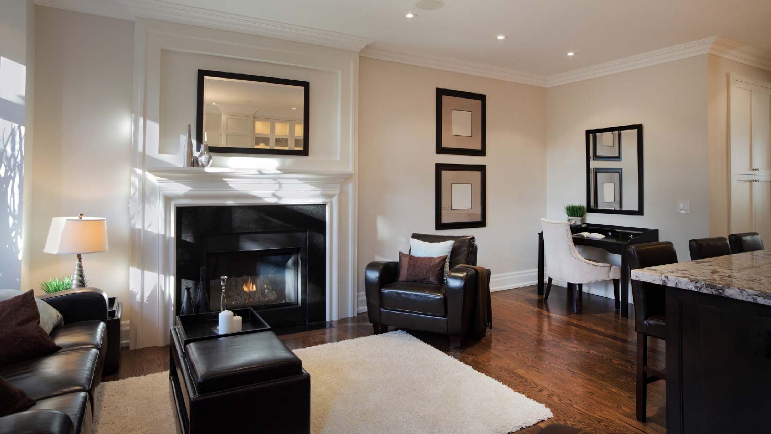 A living room with a fireplace and wafer lights