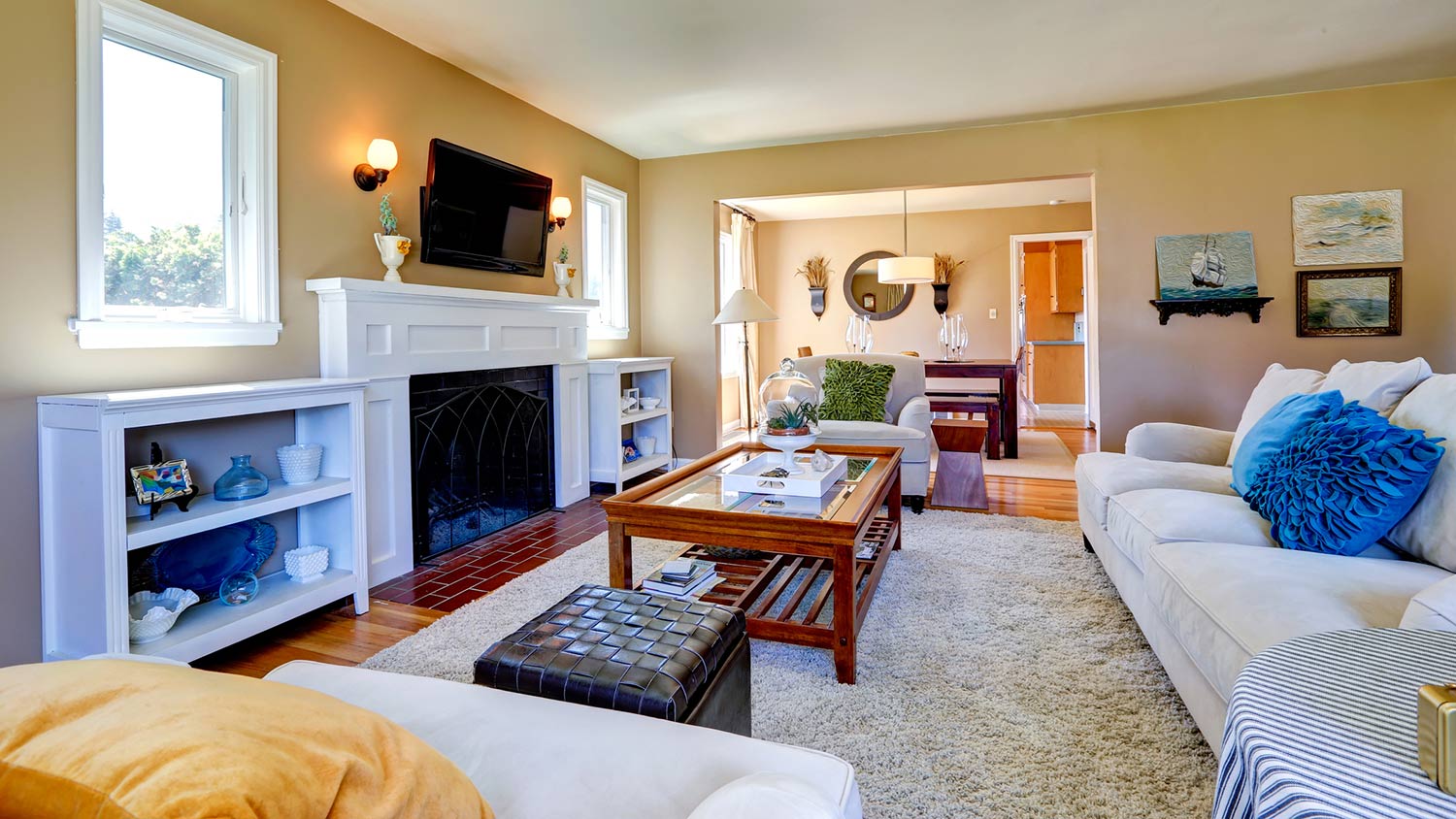 Comfortable living room and dining room with cozy fireplace
