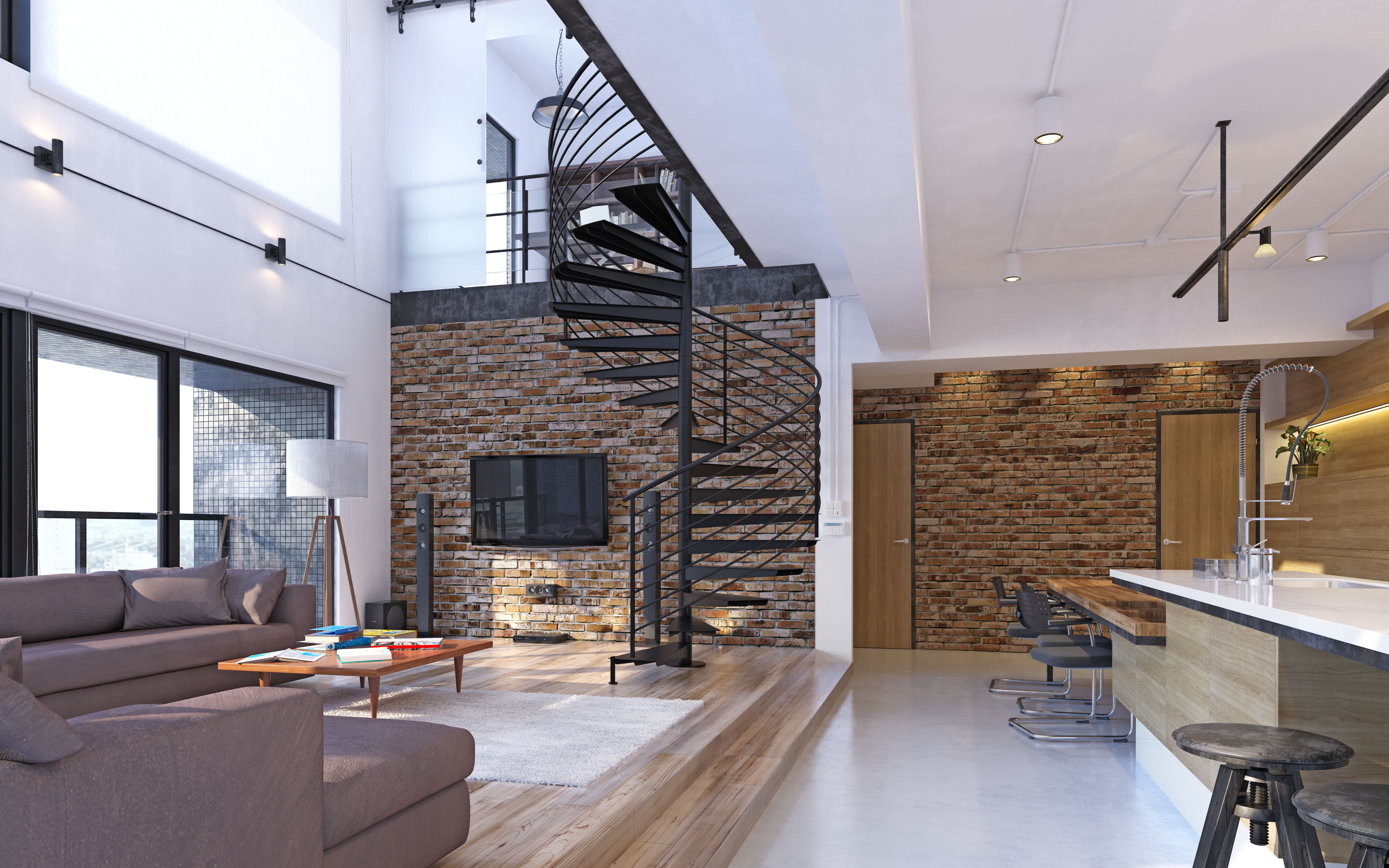 A loft apartment with a large spiral staircase