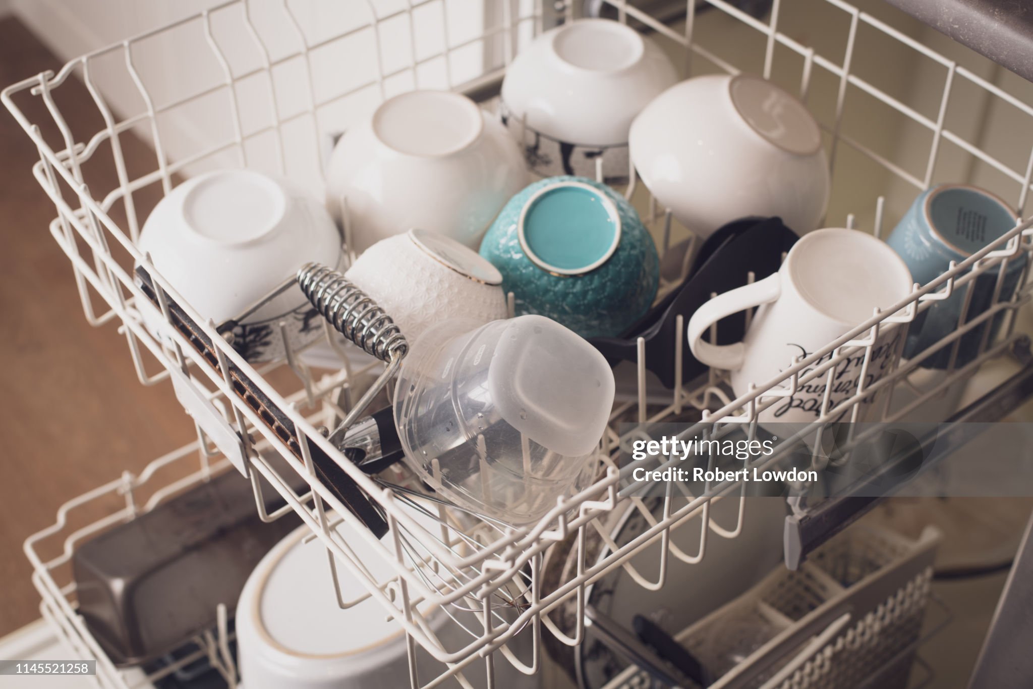 Loose dishes on the top rack of a dishwasher