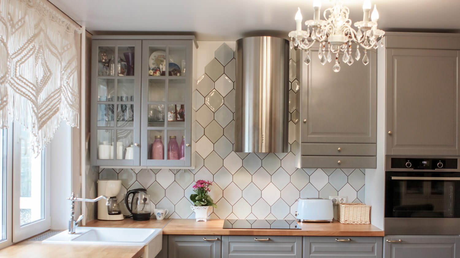 A luxurious kitchen with a chandelier