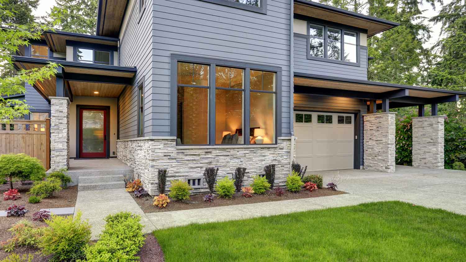 The exterior of a luxurious stone veneer house