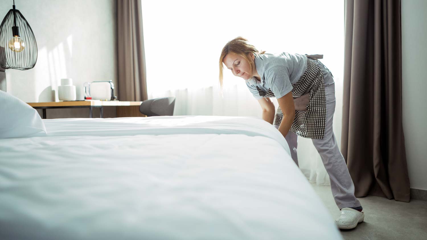 maid making up a bed