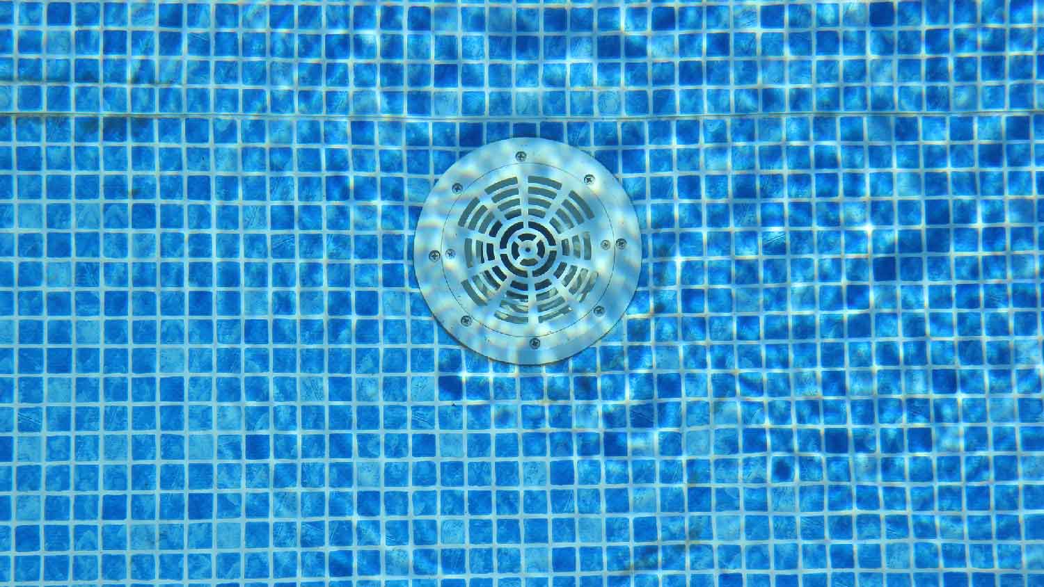 The main drain on the bottom of a pool