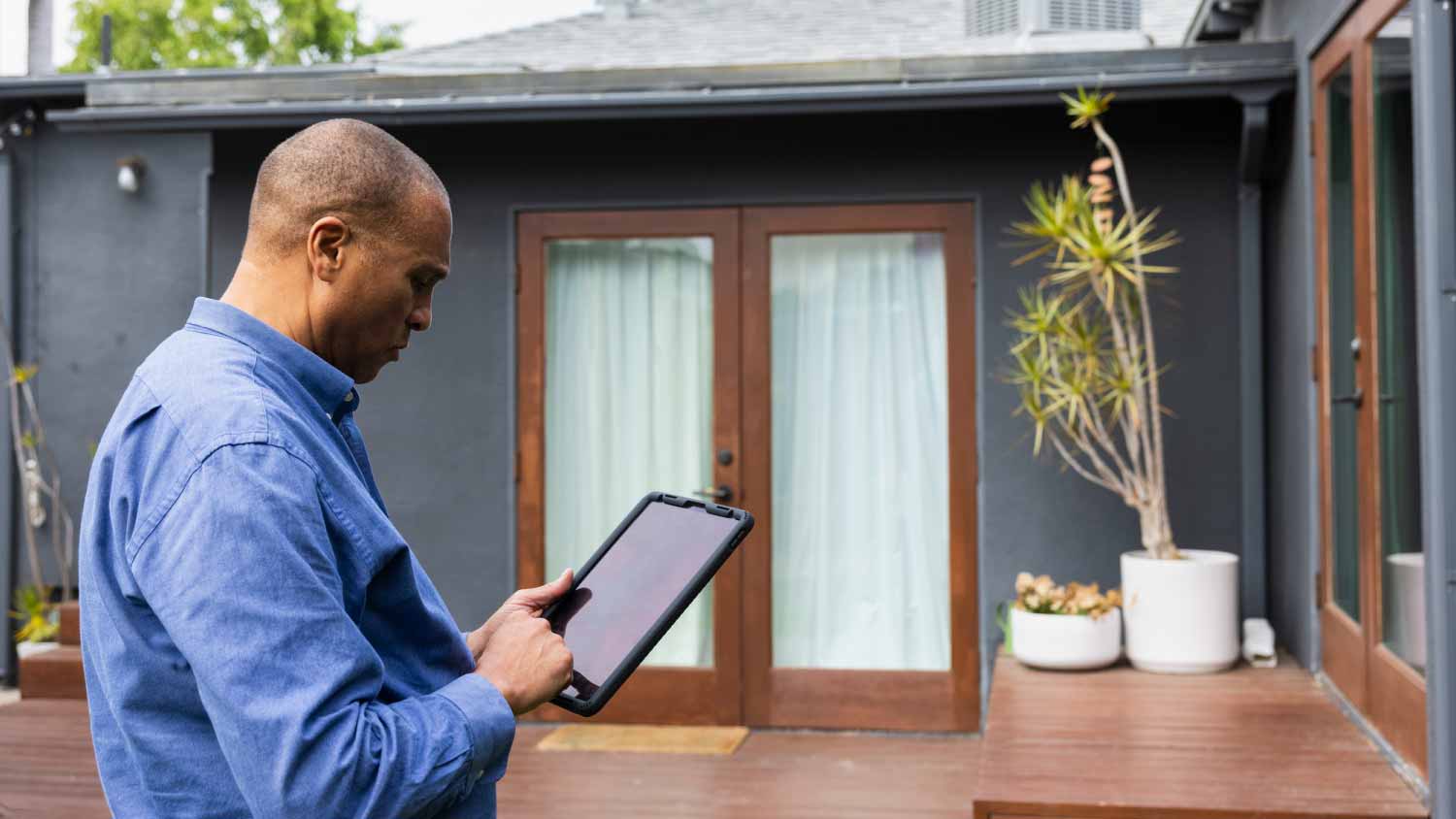 Male real estate agent using digital