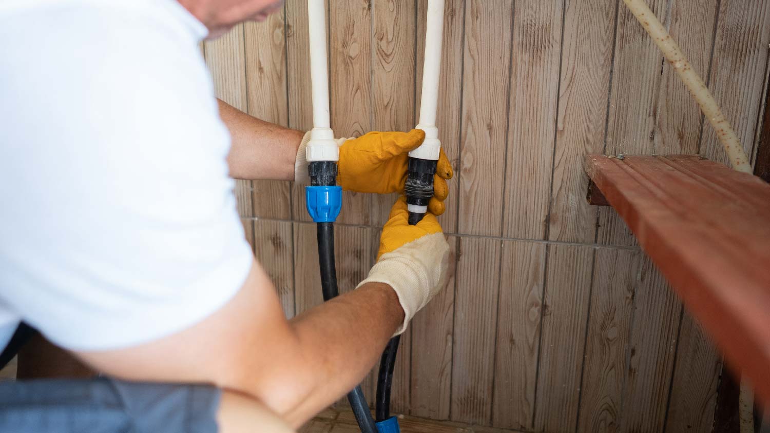 A man draining a sprinkler system