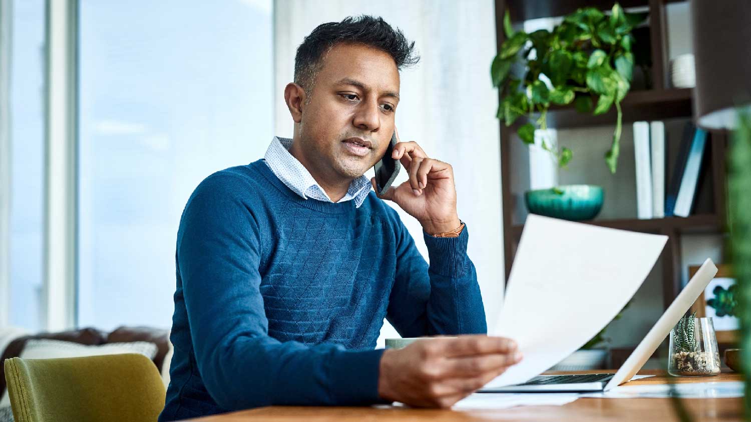 A man extending his home warranty over the phone