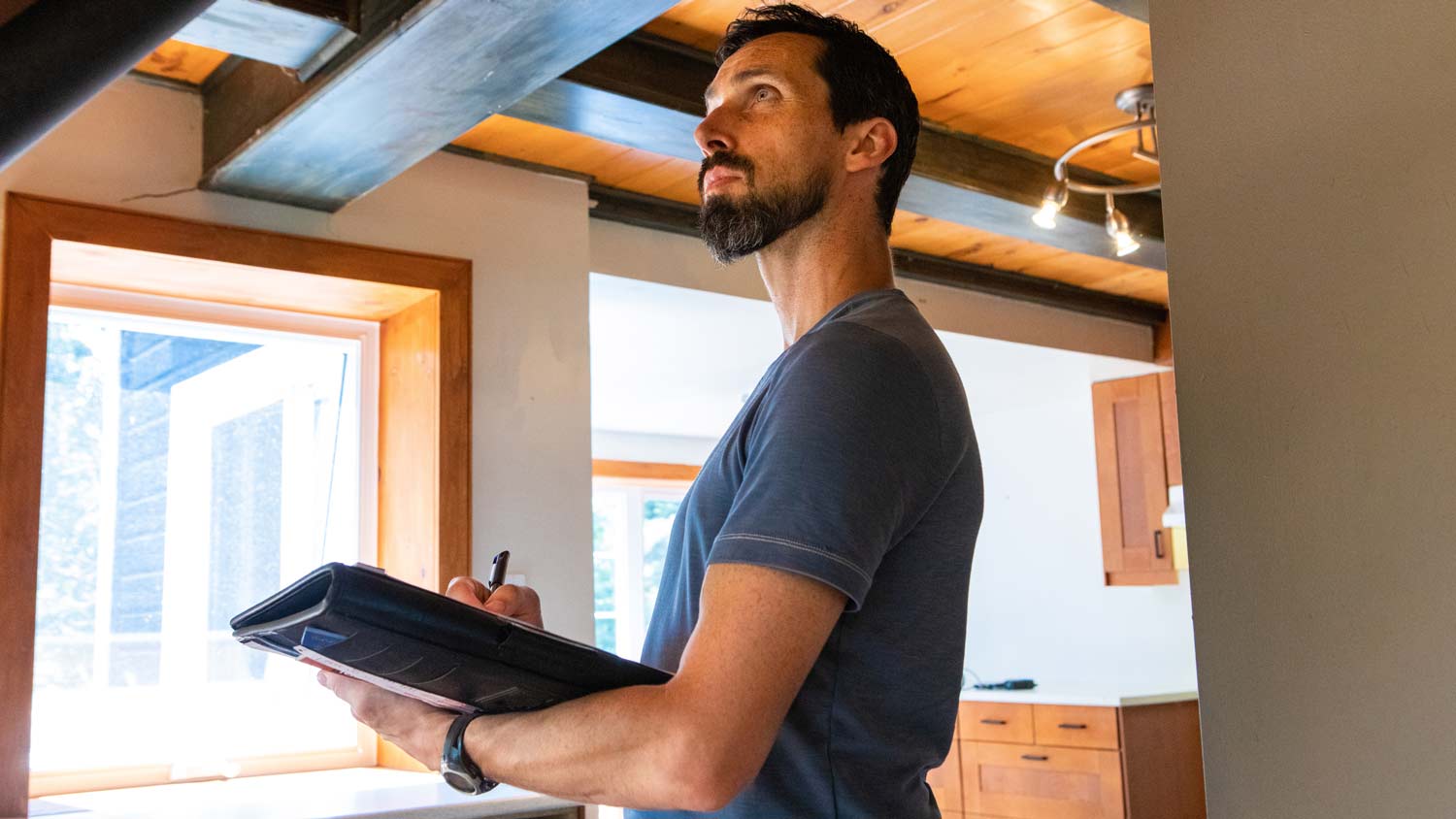 man inspecting home quality