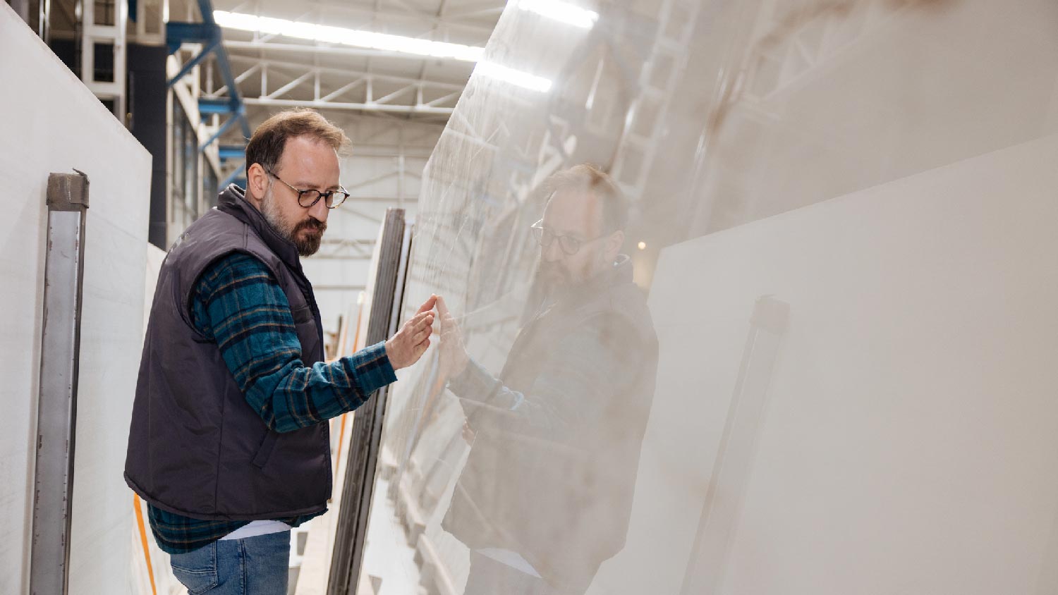 A man inspectin a quartz countertop