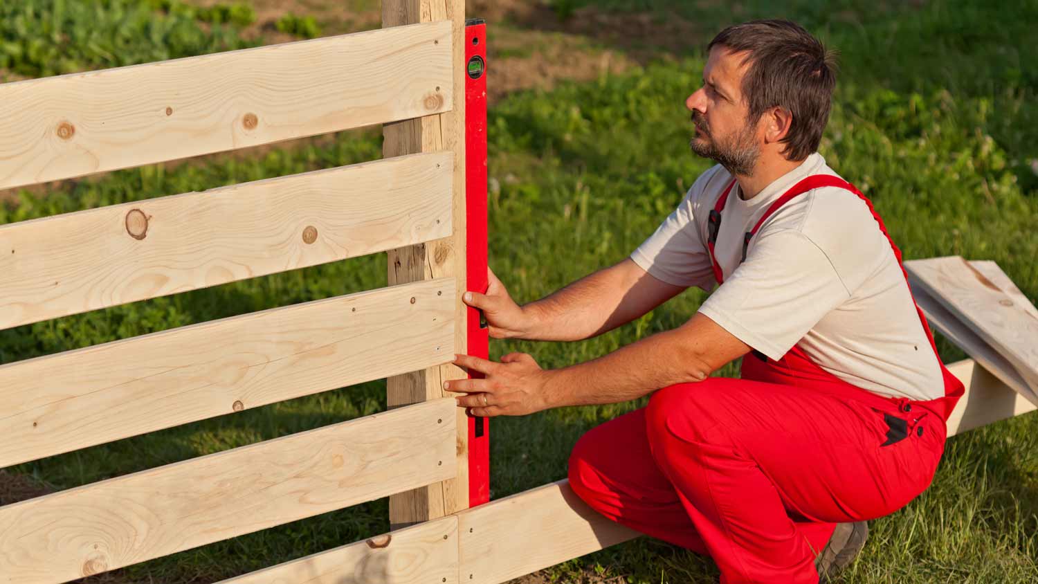 Man installing fence
