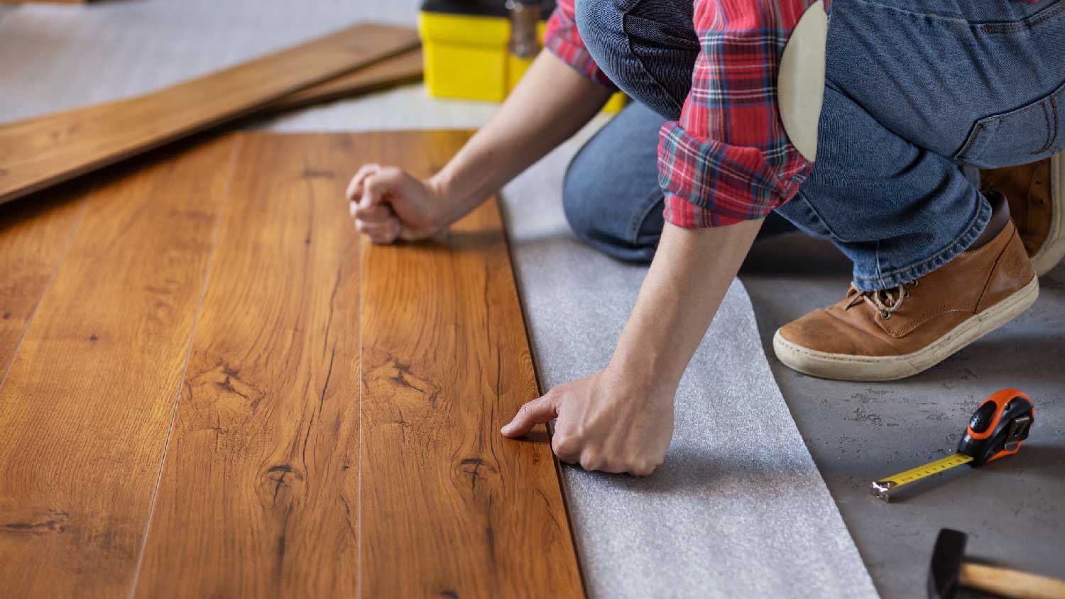 A man installing new flooring