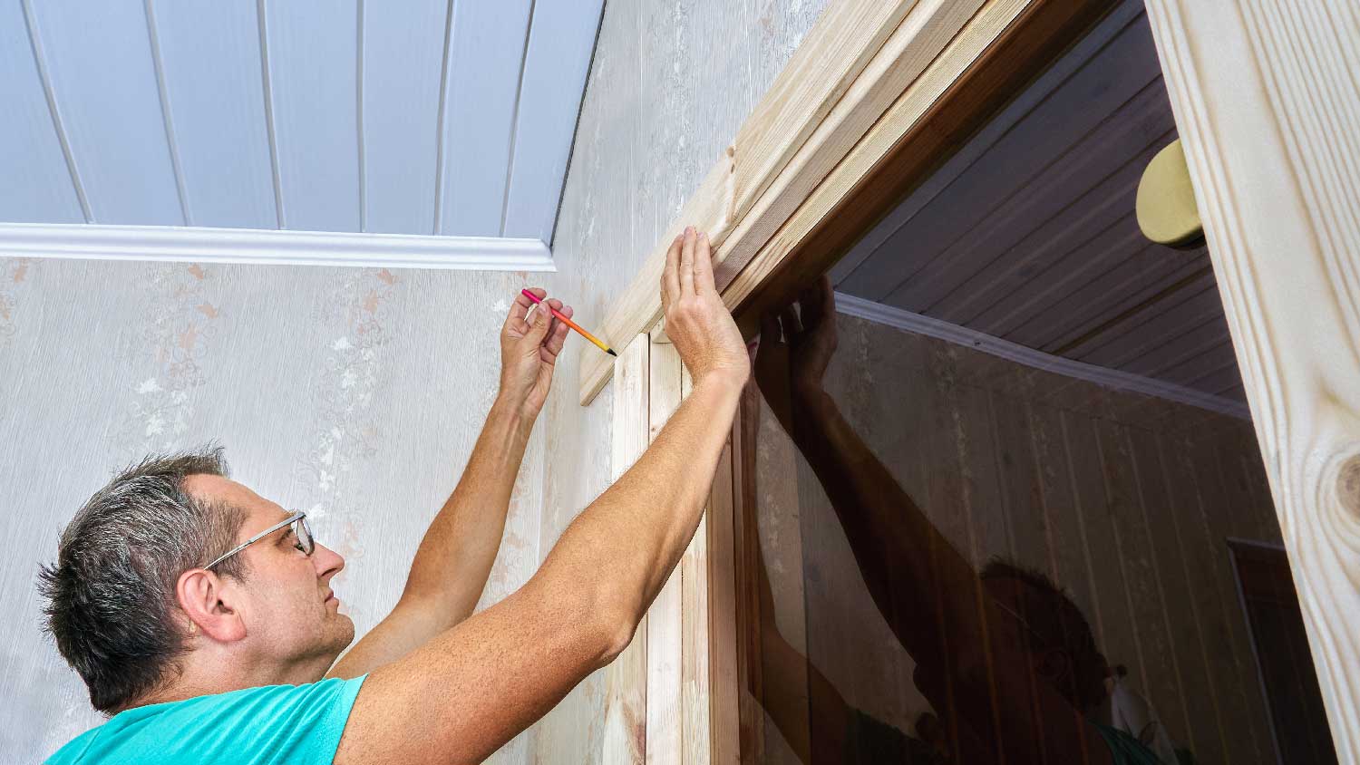 A man installing a split jamb door