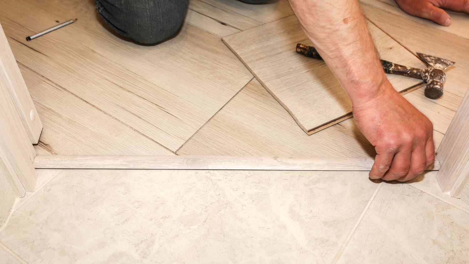 A man installing threshold