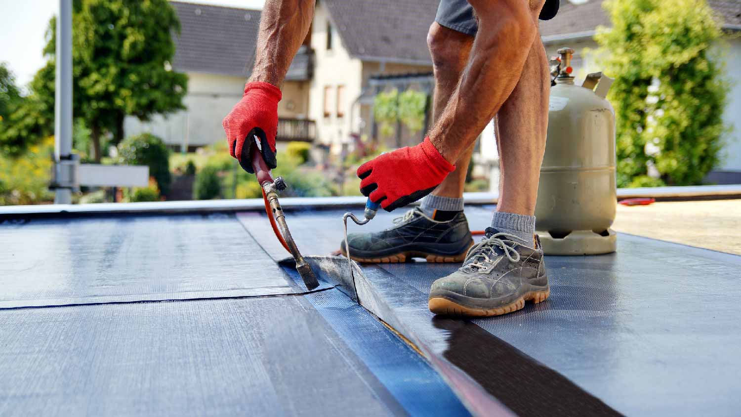 A man insulating a flat roof