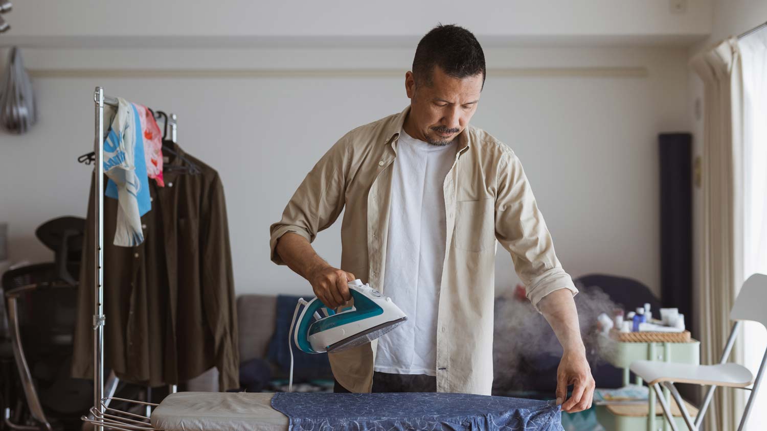 A man ironing a shirt