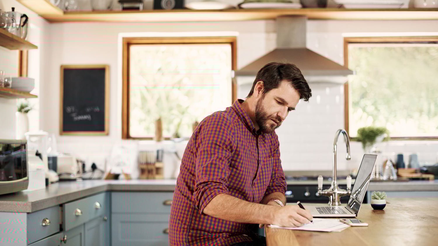 A man making lists and adjusting the budget