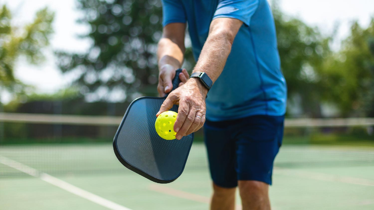 A man playing pickleball