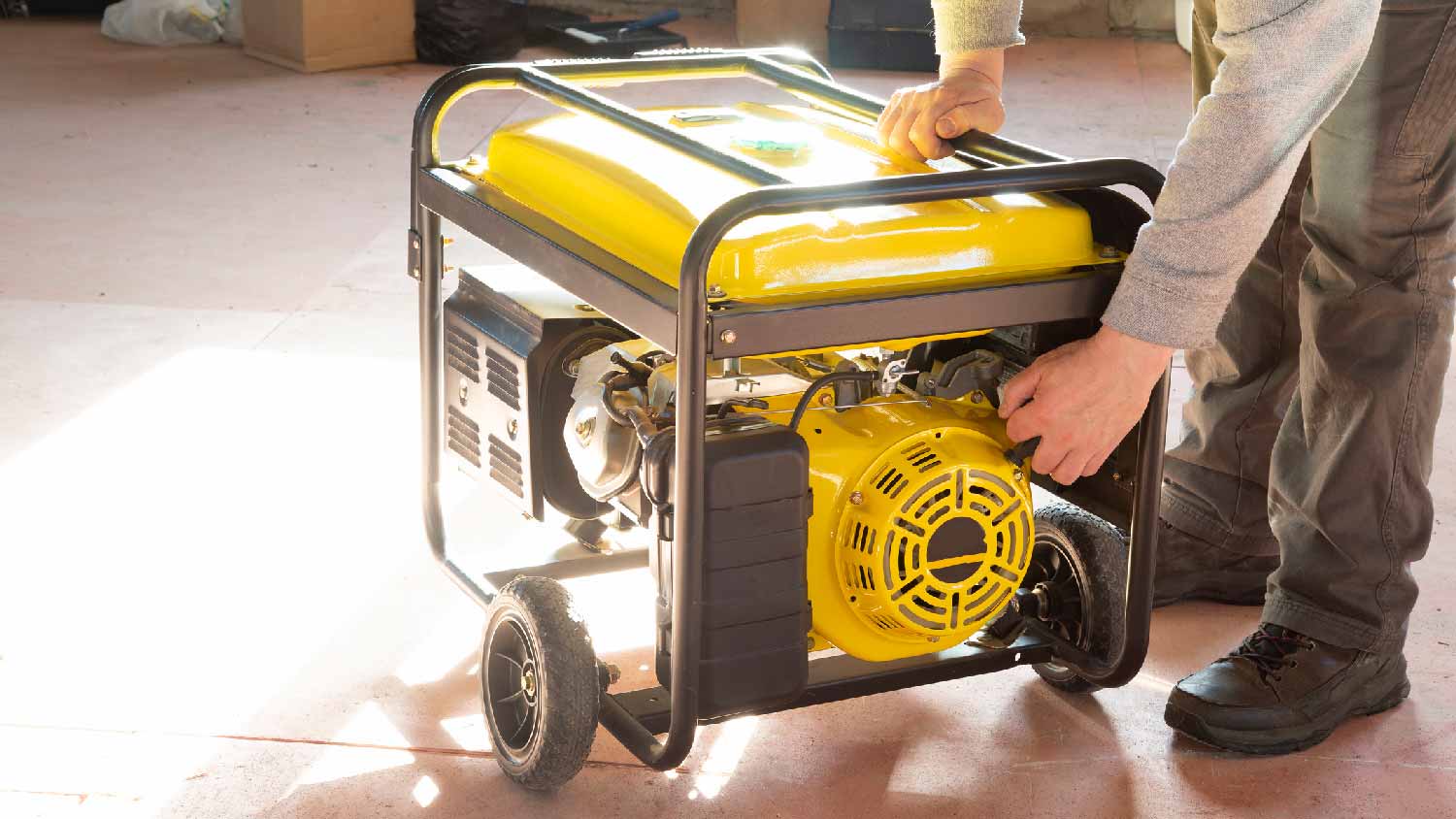 A man operating a portable gas generator