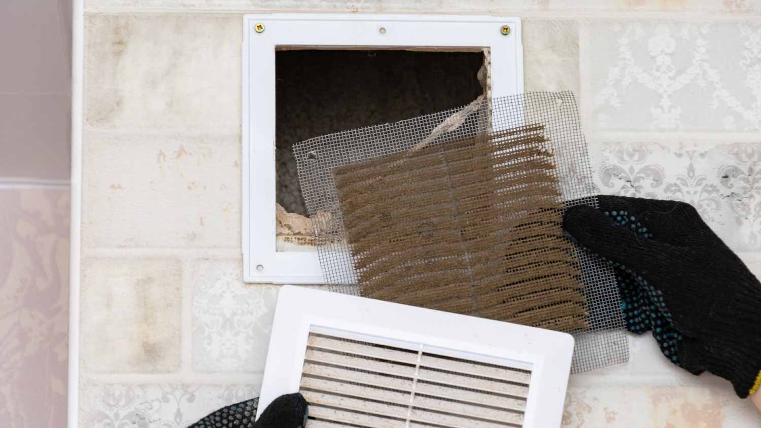 Man removing a dirty air filter