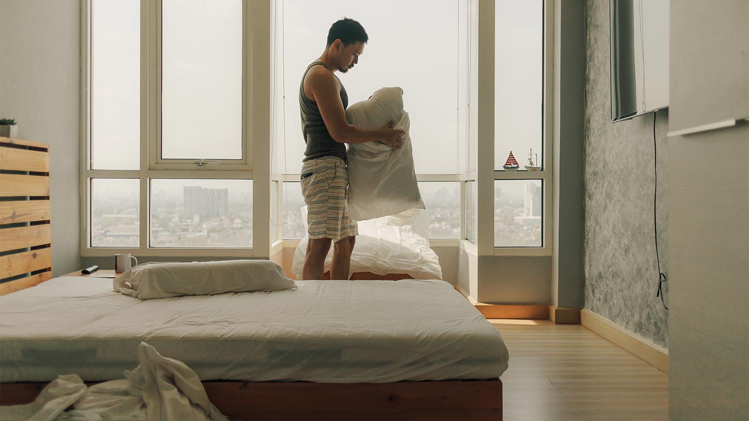 man remove pillowcase to check for bugs