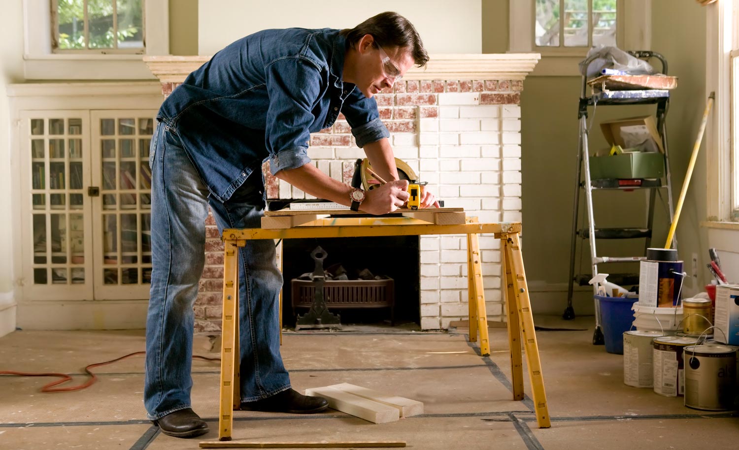 A man renovating the interior of a room