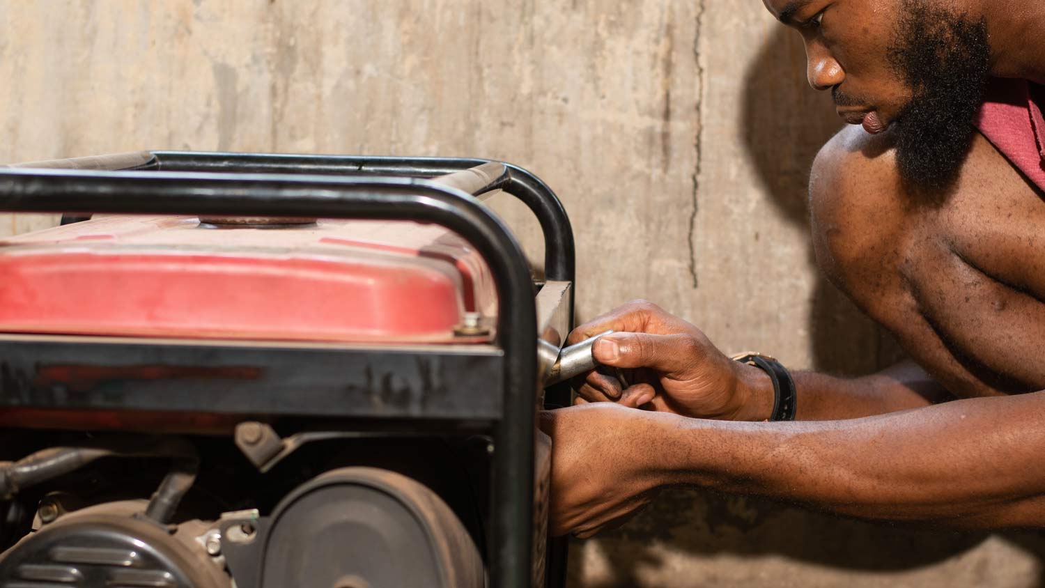 man working on generator