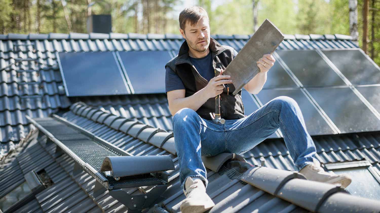 A man repairing his roof