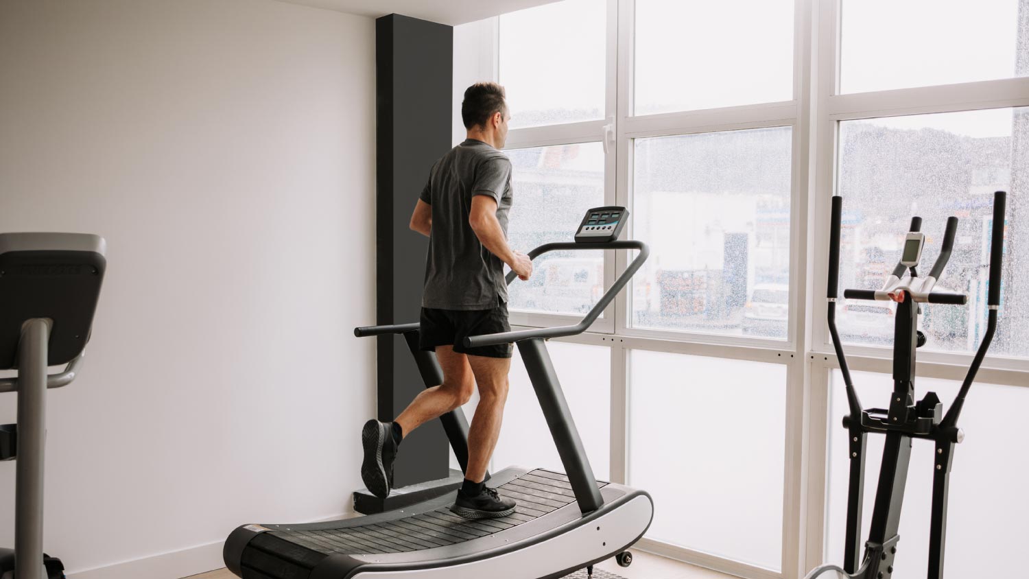 man running on a treadmill in the gym