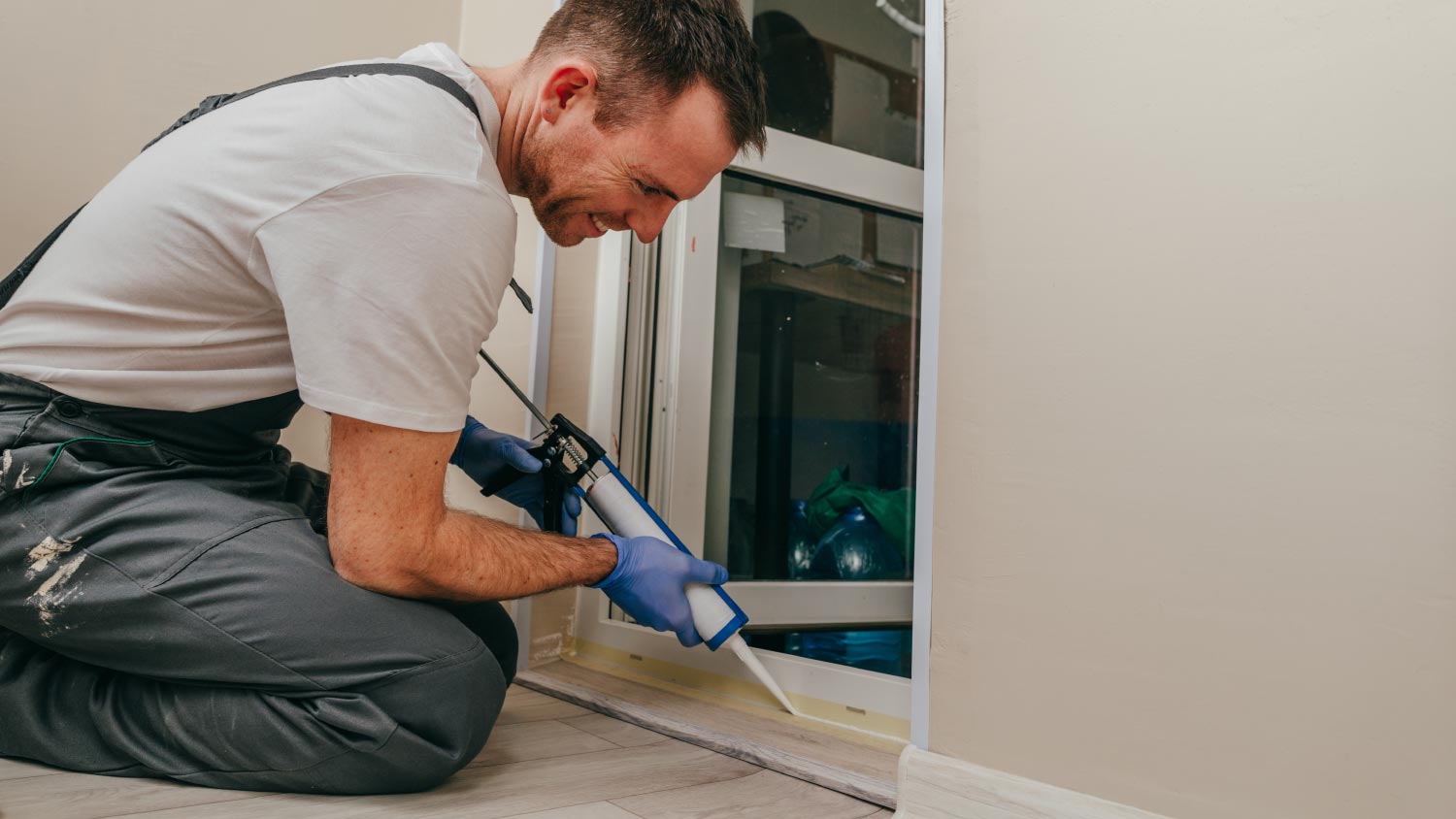 A man sealing a door