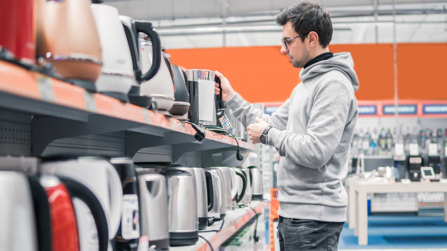 man shopping for a new kettle 