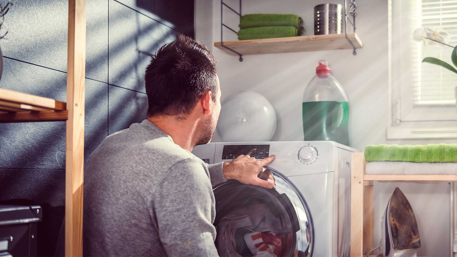 Man starting washing machine