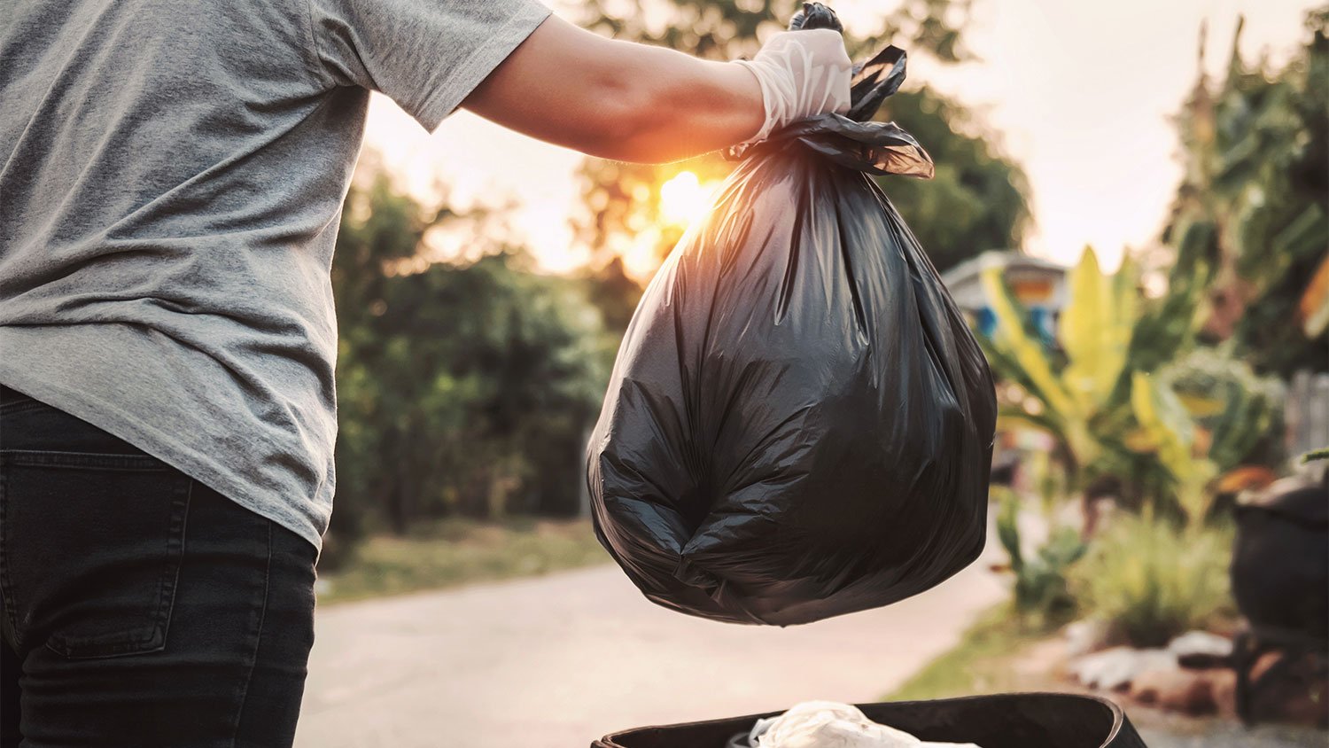 A man throws out garbage