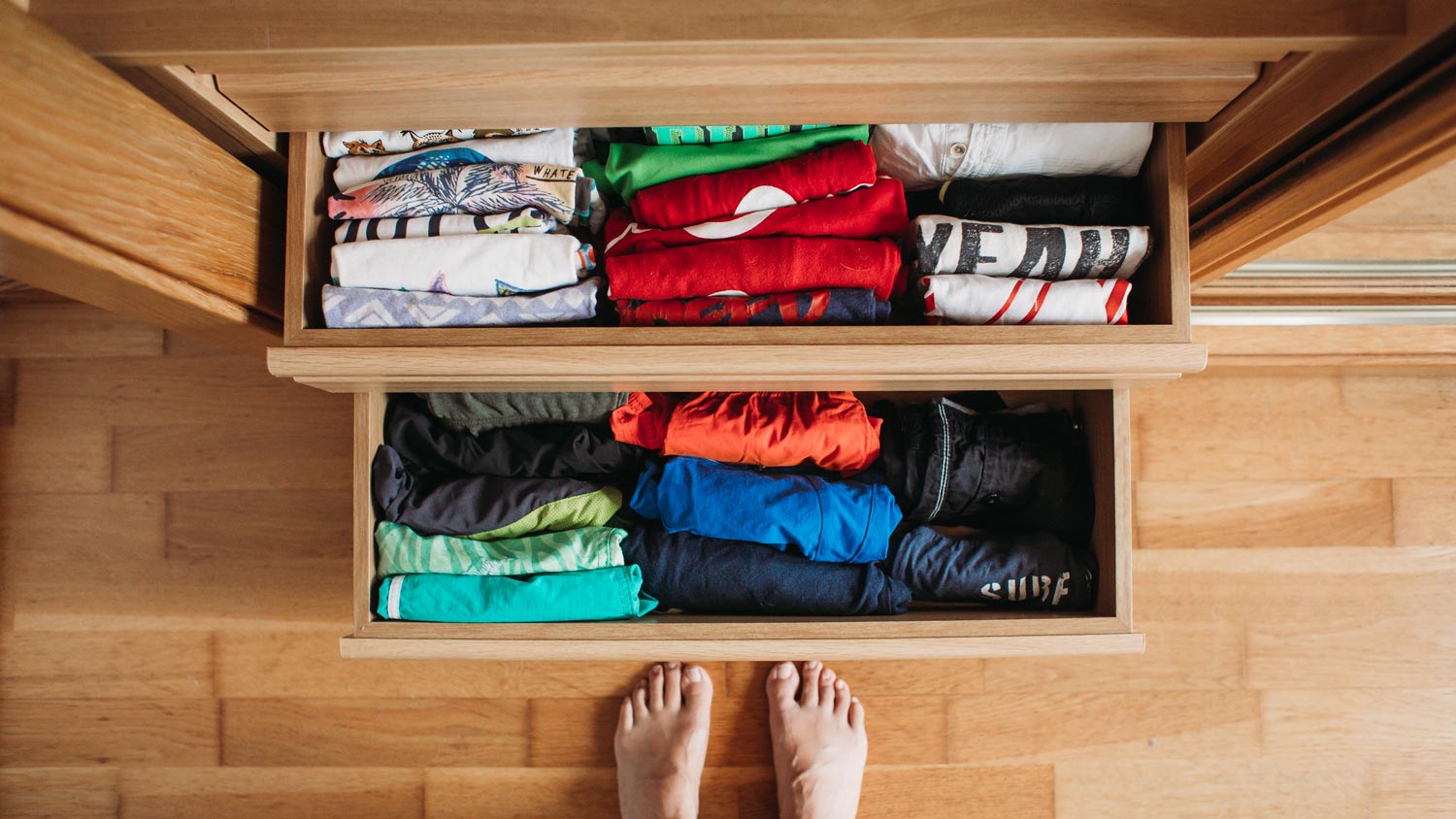 A tidy drawer with folded clothes