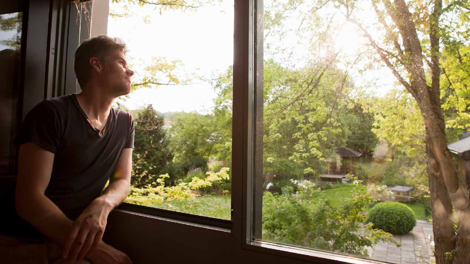 A man trying to identify a window