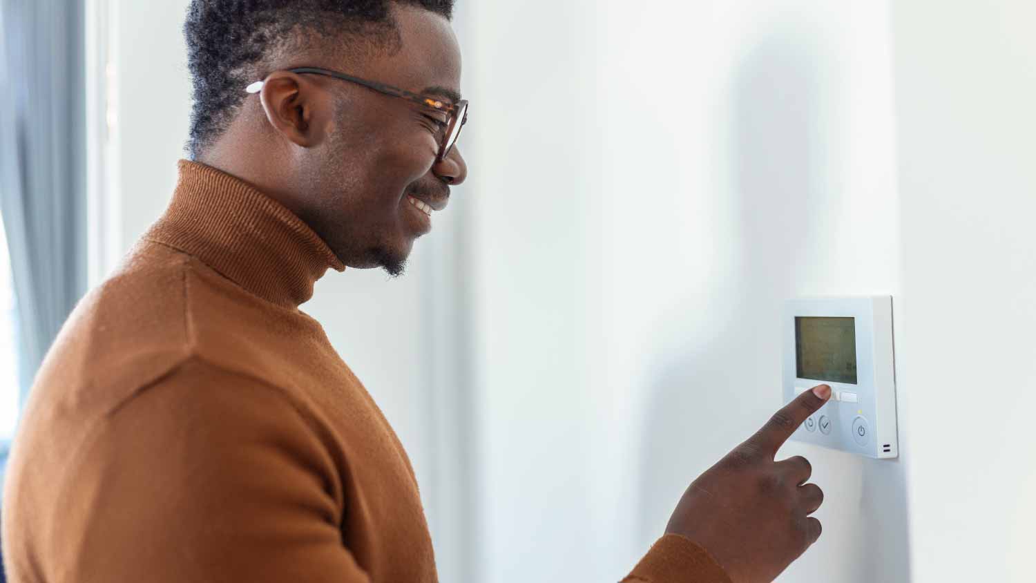 Man using modern smart home system