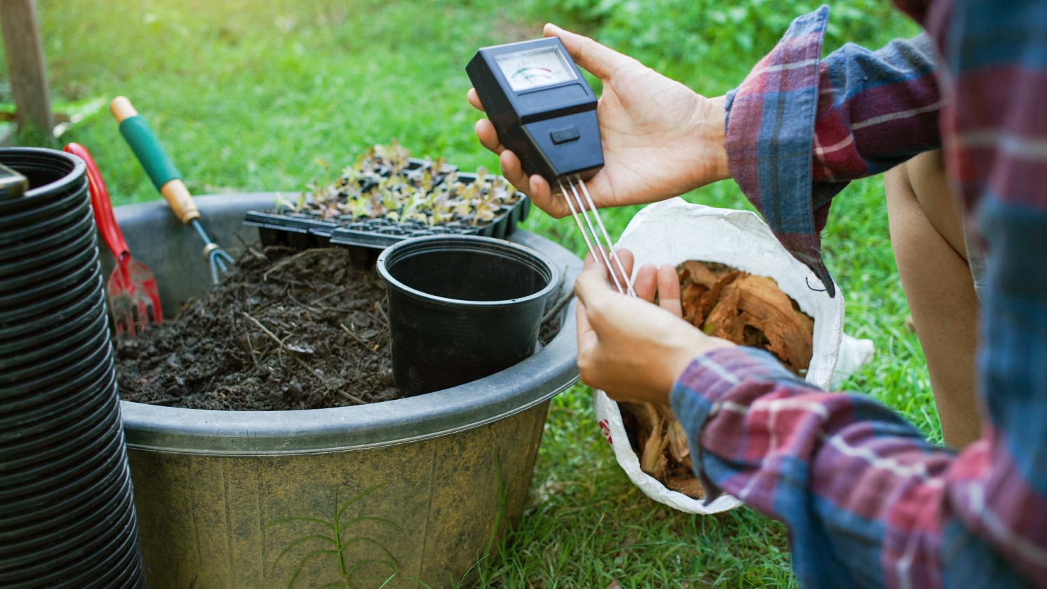 A man using a monitor to measure pH balance