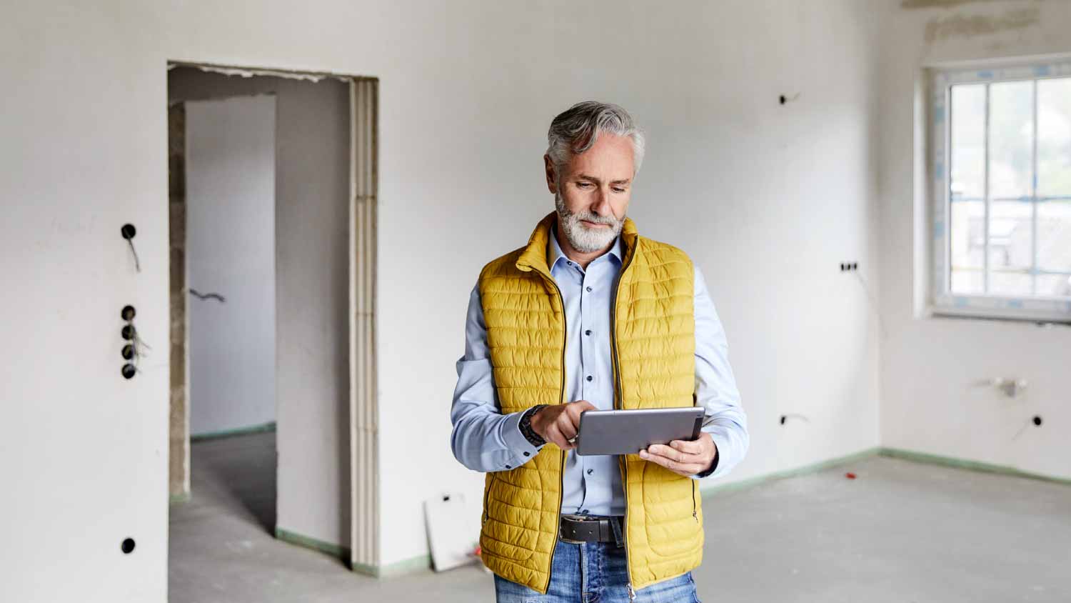 Man using tablet on a construction site