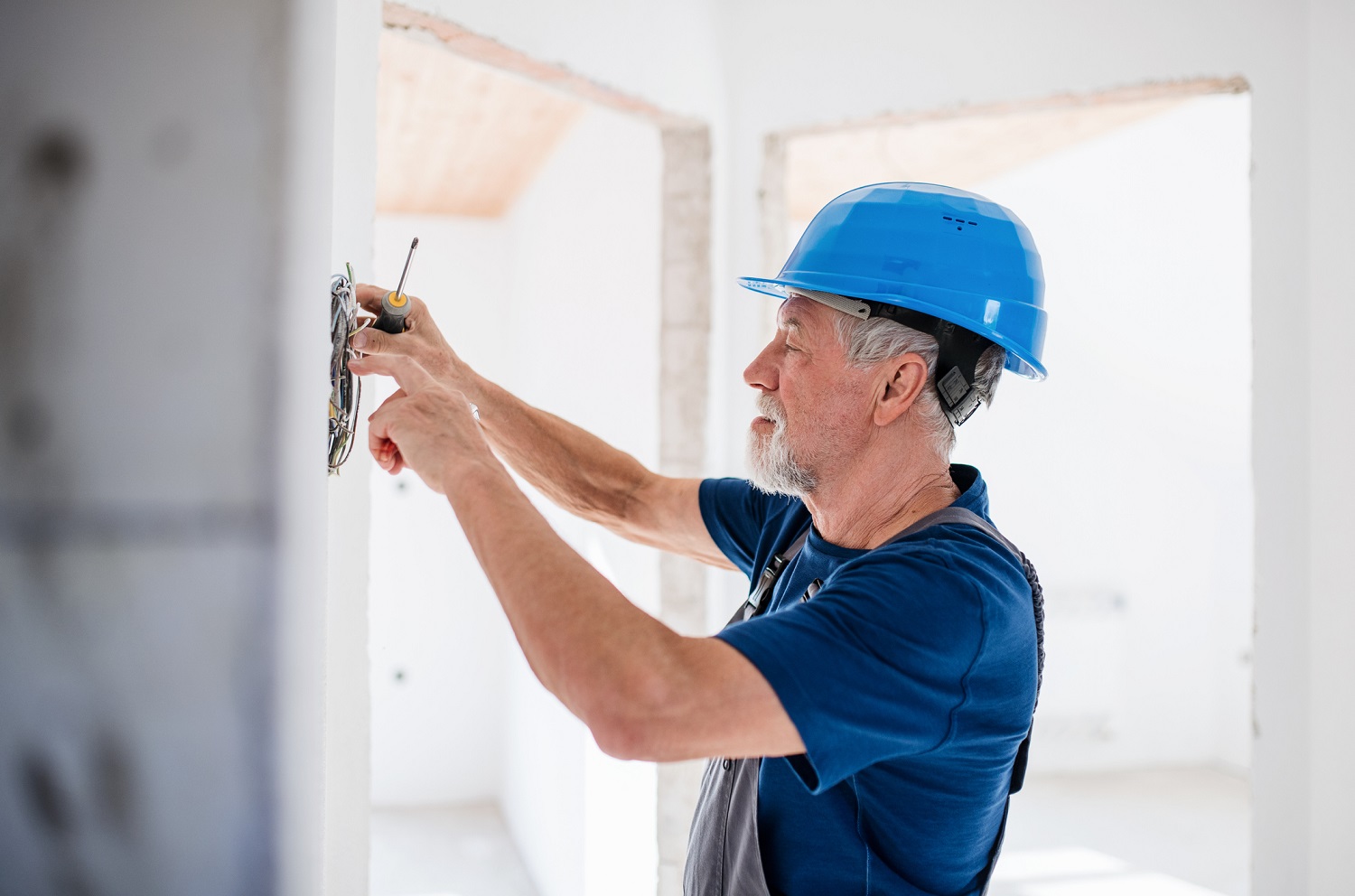 A man working on interior of new house