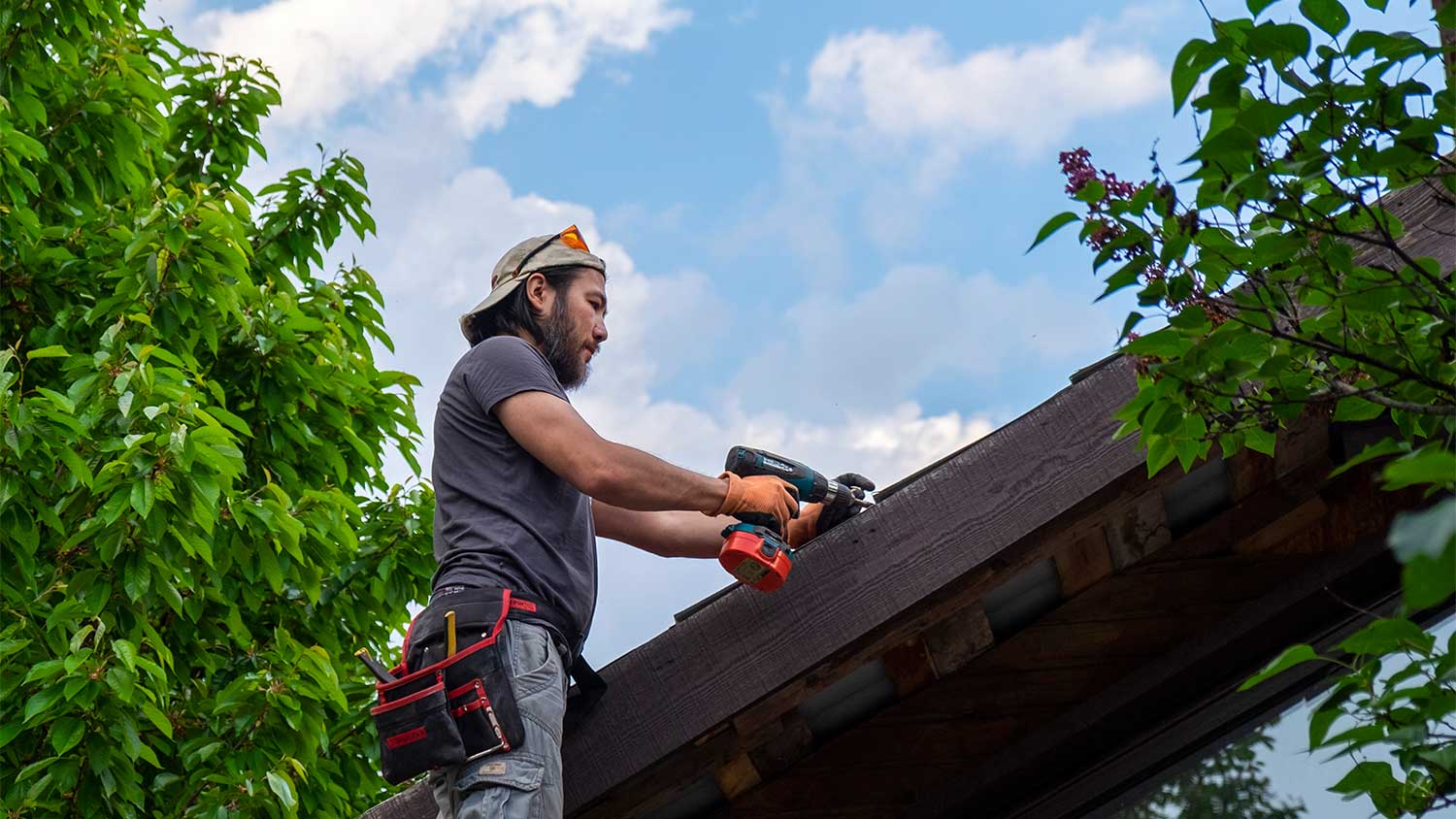 A man works on a roof