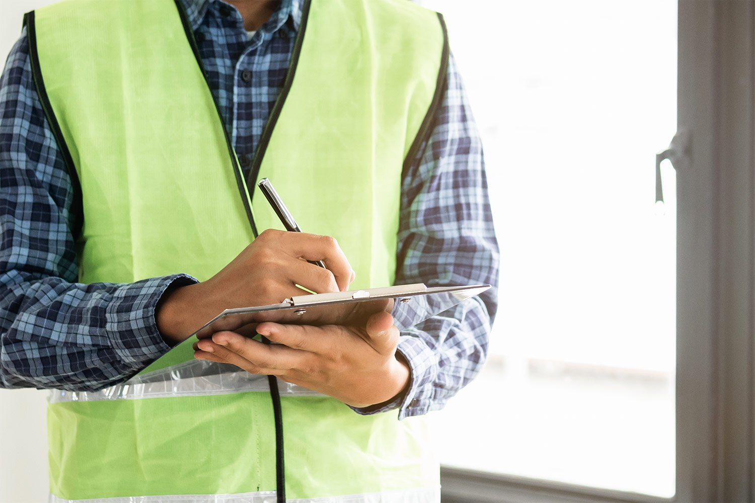 Man writing home inspection report