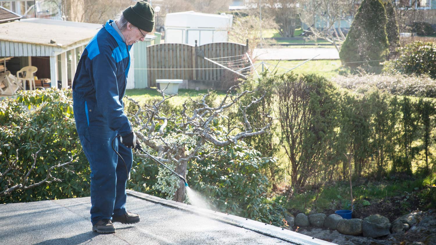 Man spraying flat roof