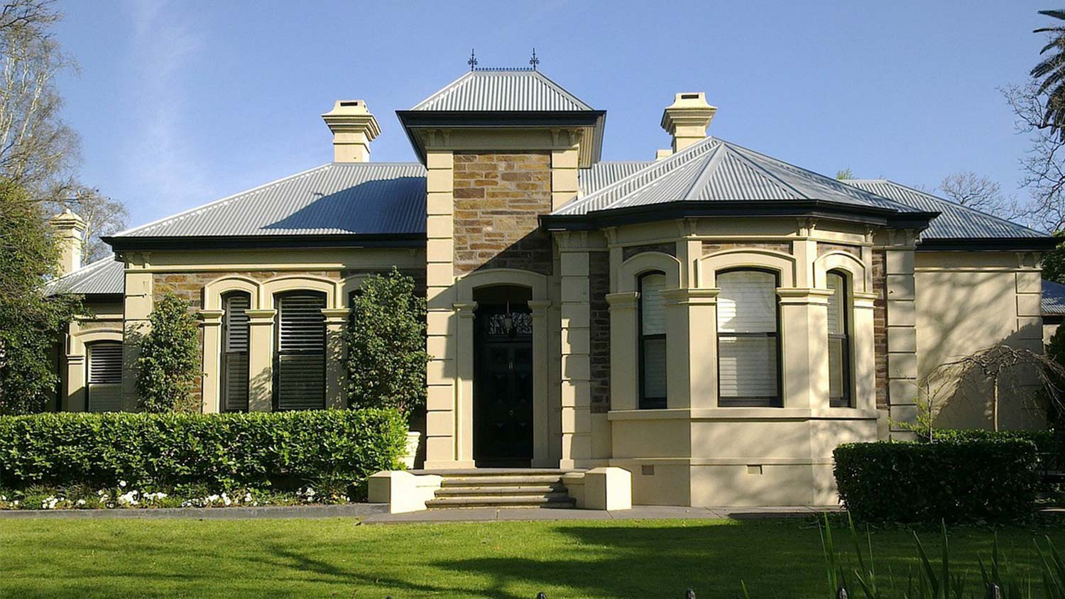 A lawn with manicured shrubs