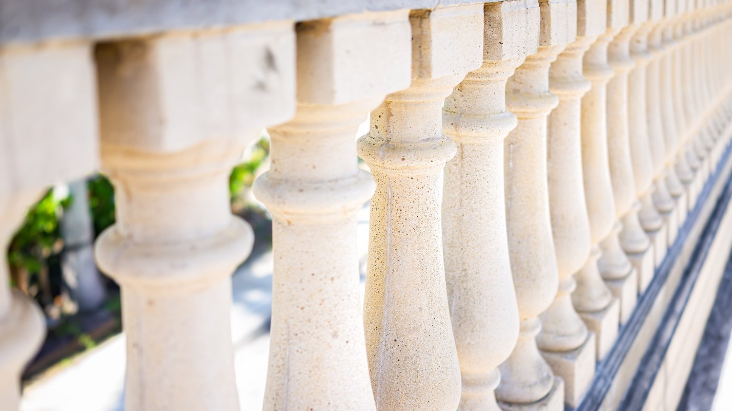 White stone columns wall fence railing closeup