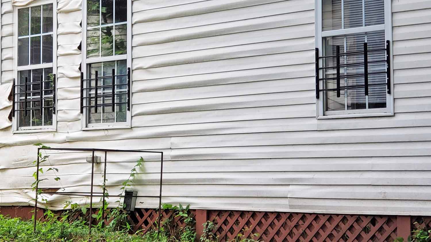 house with melted vinyl siding