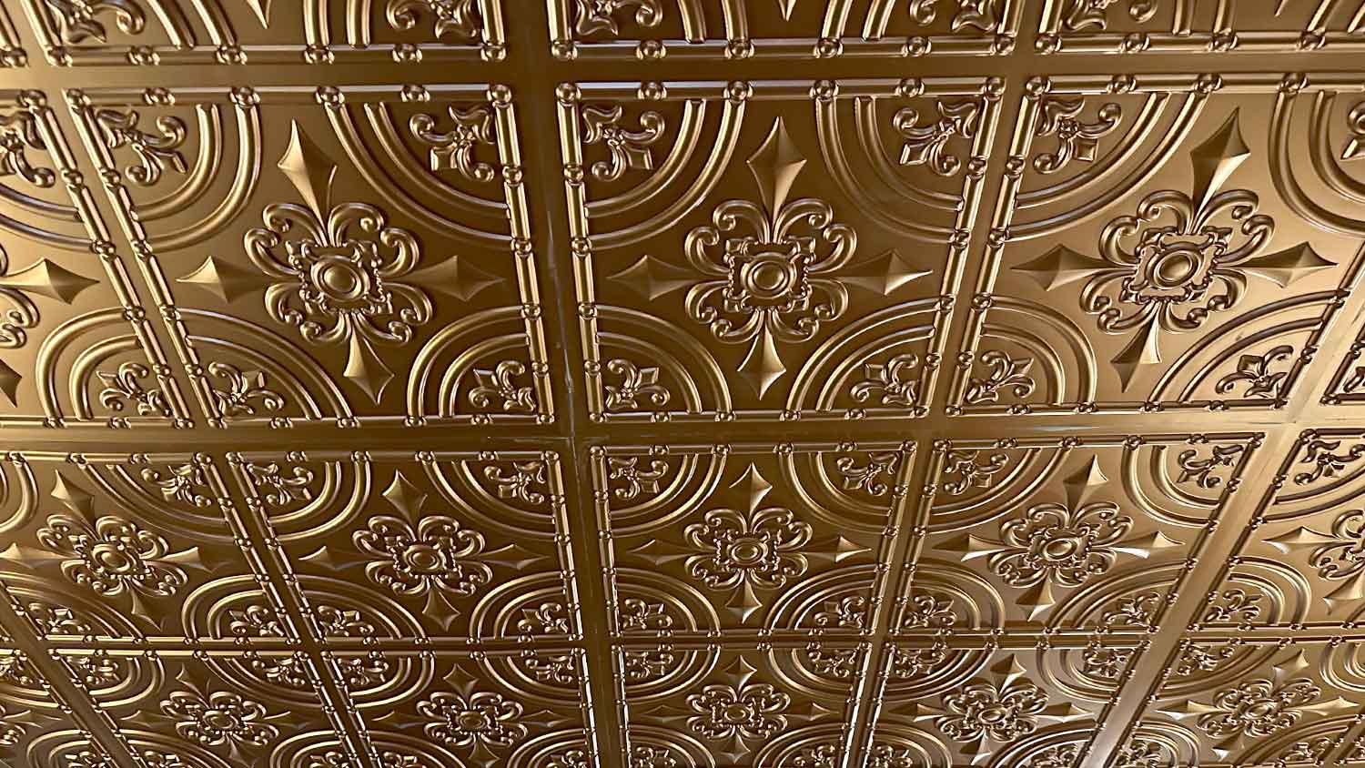 Metal ceiling tiles with decorative pattern