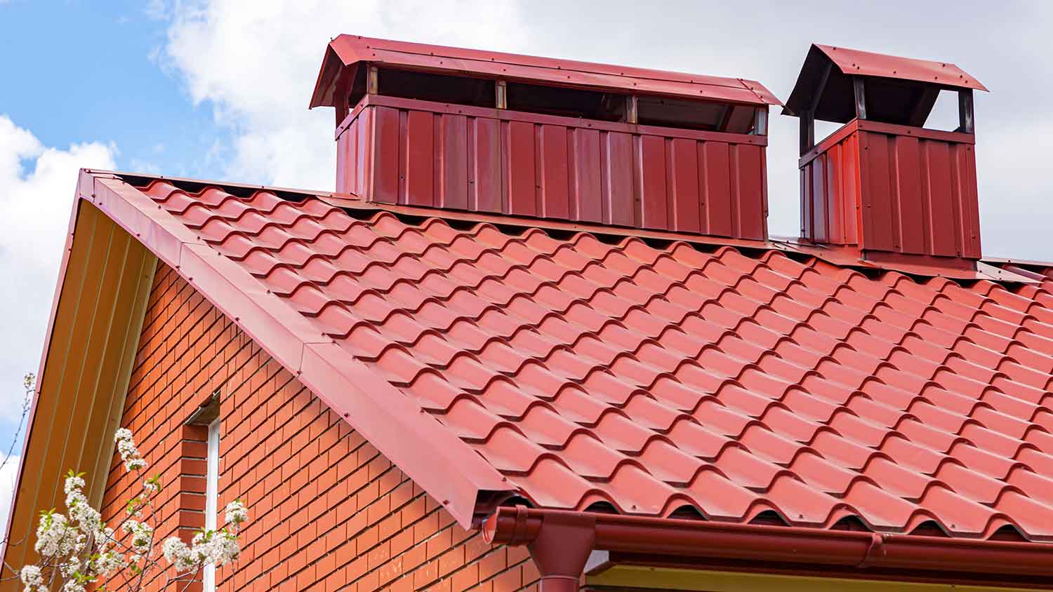 Type C drip edge installed on a red metal roof